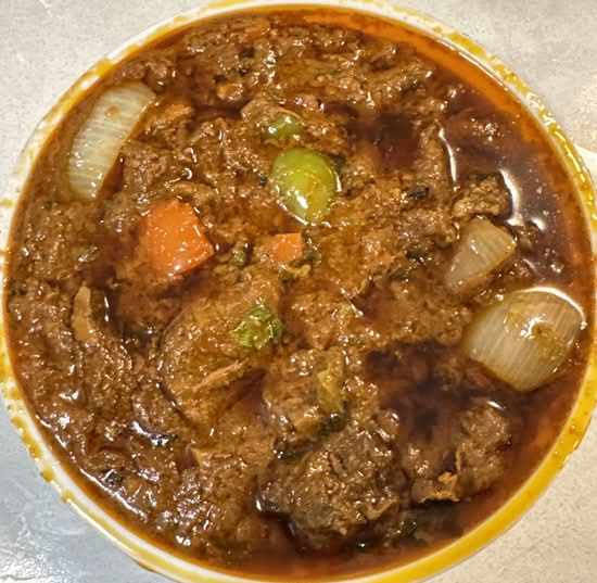 Rich butter chicken curry in Calgary NE